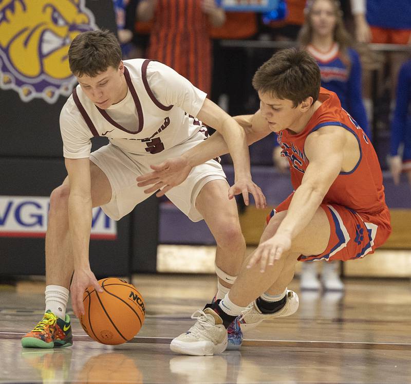 Eastland’s Parker Krugman fights for a loose ball against Tremont’s Graham EmichMonday, March 9, 2026, in the Class 1A Macomb Supersectional.