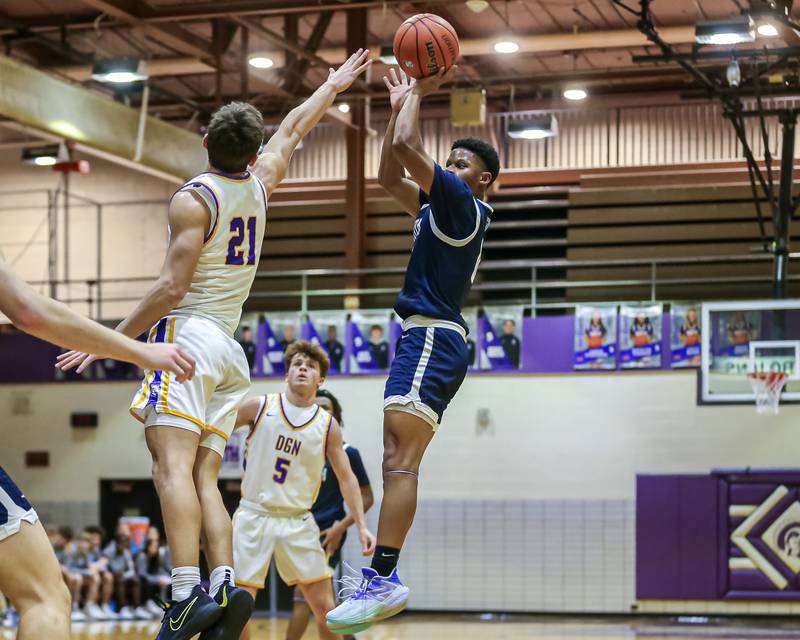 Downers Grove South's Jalen House (0) shoots a jump shot during basketball game between Downers Grove South at Downers Grove North. Dec 16, 2023.