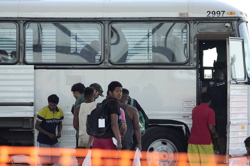 Migrants who entered the U.S. from Mexico are loaded on to a bus at a processing center, Thursday, Sept. 21, 2023, in Eagle Pass, Texas. (AP Photo/Eric Gay)