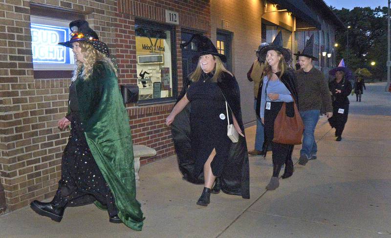 A group of witches, make their way to Gayles Monroe Tap during the Streator Chamber sponsored Halloween Spooktacular scavenger hunt Friday night.