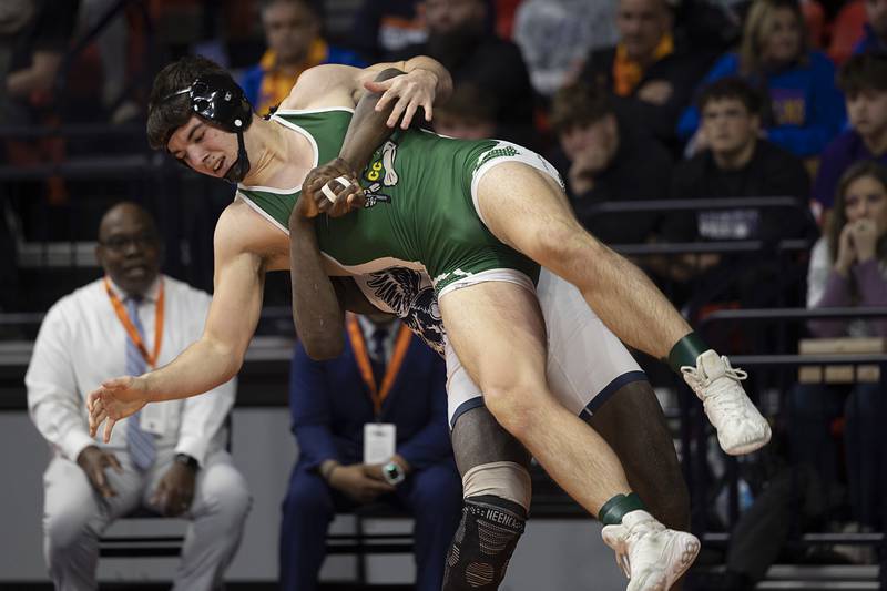 Coal City’s Brock Finch is thrown by Arkail Griffin in the 1A 175 pound class Saturday, Feb. 21, 2026, at the IHSA wrestling finals in Champaign.