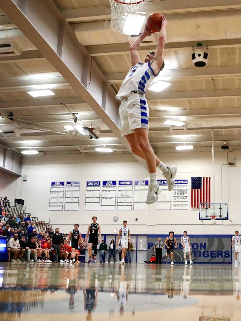 Princeton senior Teegan Davis soars for a break-away, uncontested dunk off a Byron turnover that sparked the Tigers late in the third quarter on the way to a 49-38 victory at Prouty Gym Tuesday night.