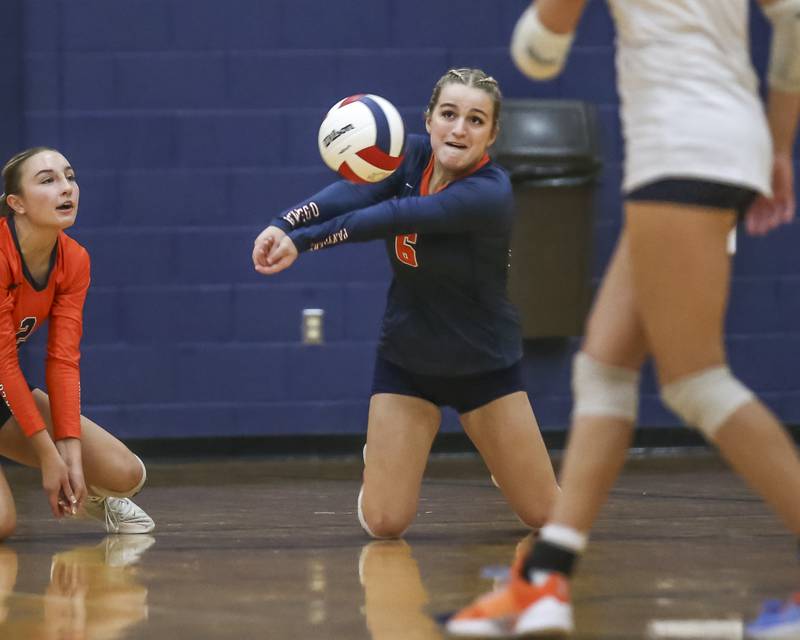 Oswego's Amelia Mosley (6) digs a serve during volleyball match between Romeoville at Oswego. Oct 16, 2025.