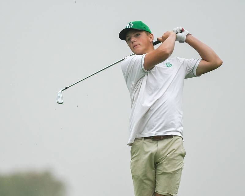 York High School golfer Gage Jacobs watches his ball after teeing off during the West Suburban golf match on Tuesday Sept. 24, 2024, held at Prairie Bluff Golf Course in Crest Hill.