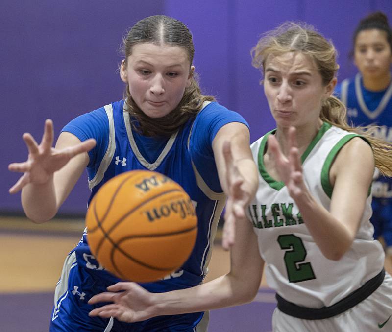 Newman’s Veronica Haley and Alleman’s Lindsey Britton go after a loose ball Friday, Dec. 26, 2025, at the Duchesses Basketball Christmas Classic.