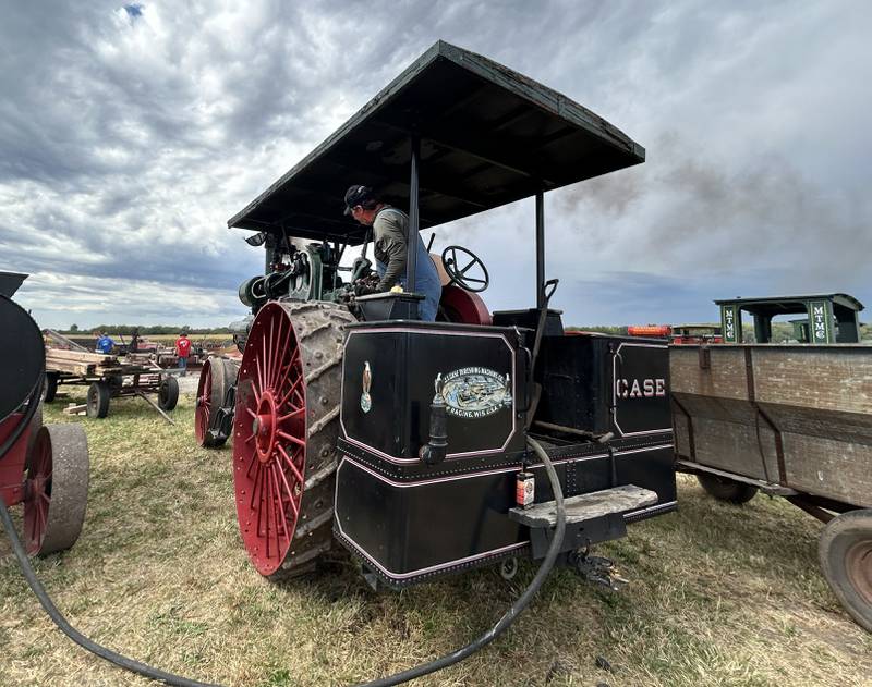 Charles Hubbard of Chana uses his 1916 Case steam engine to power a sawmill at the Bos Bros. Historical Farm Old Fashioned Fall Harvest south of Erie on Saturday, Sept. 21, 2024. Hands-on demonstrations of past agricultural chores were highlighted at the event. The sawmill was being used to cut cedar logs into a square so shingles could be made at another vintage machine at the event.