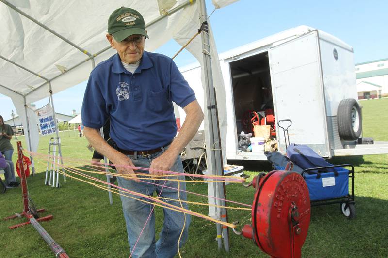 John Lahr, of Round Lake gets a Rope Master, about 100 years old, ready for a visitor to make a rope during the Lake County Farm Heritage & Harvest Festival at the Lake County Fairgrounds on September 23rd in Grayslake. The festival was sponsored by the Lake County Farm Heritage Association. Lahr is a member of the association and grew up on a farm on Gilmore Rd. in Fremont Township.
Photo by Candace H. Johnson for Shaw Local News Network