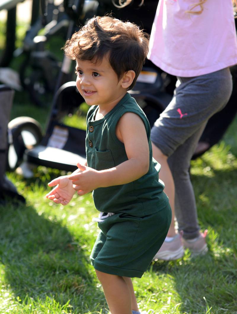 Julian Sapru of Wood Dale dances to German polka music while attending the Octoberfest held at Brookfield Zoo Saturday, Sept. 23, 2023.