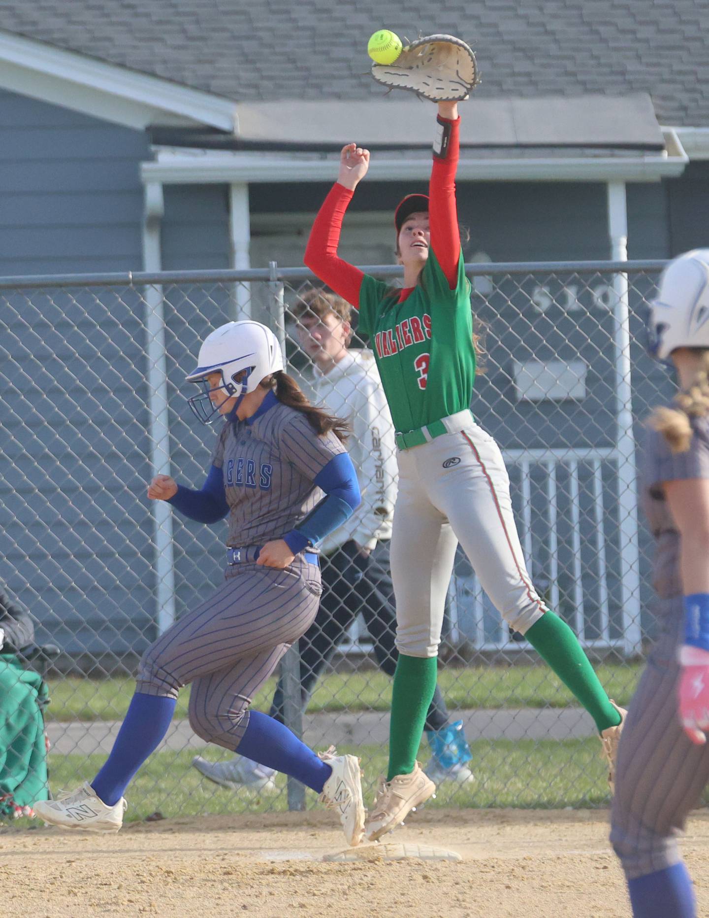 L-P's Dagny Greer misses the throw at first base as Princeton's Izzy Gibson steps safely on the bag on Tuesday, March 24, 2026 at Little Sibera Field in Princeton.