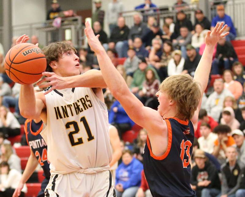 Putnam County's Orlando Harris (left) looses control of the ball as Pontiac's Drew Wayman (right) defends during the Colmone Classic tournament on Friday, Dec. 9, 2022 at Hall High School in Spring Valley.