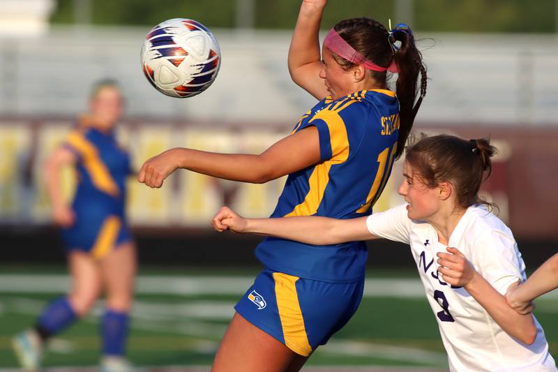 Johnsburg’s London Baidinger, left, battles Alexia Conine of North Shore Country Day in IHSA Class 1A Sectional Title Game action at Richmond-Burton High School in Richmond on Tuesday, May 27, 2025.