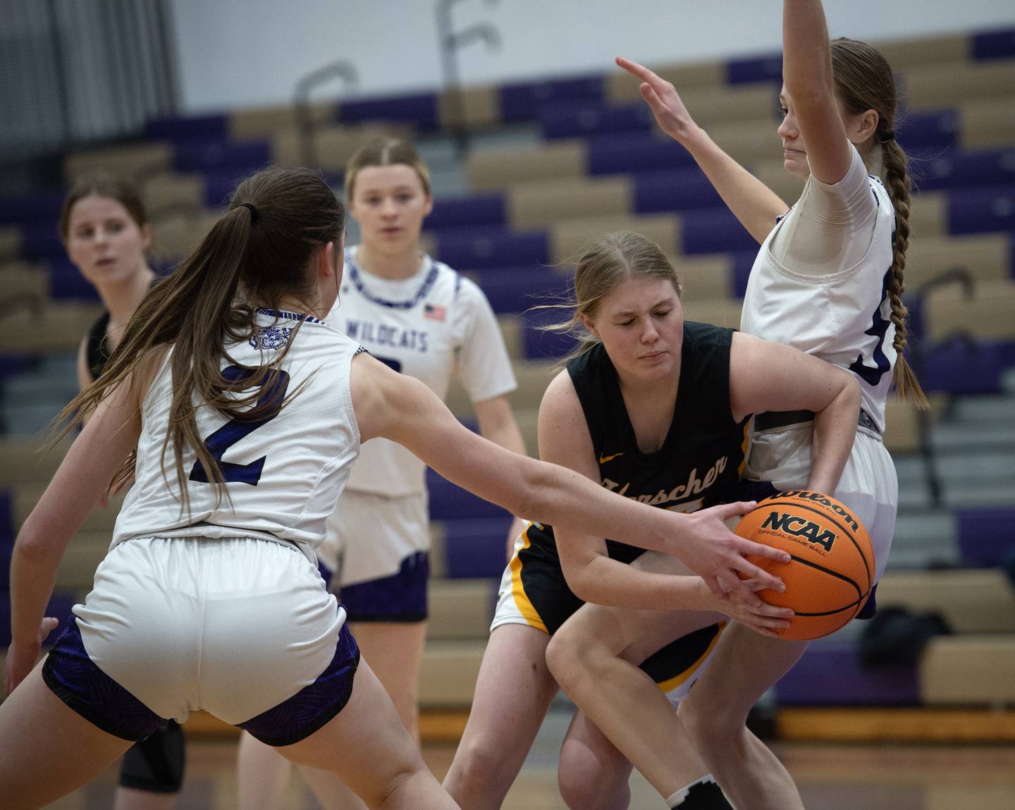 Herscher's Audrey Hoffman, center, tries to work between Wilmington's Sami Liaromatis, left, and Keeley Walsh, right, in a game on Thursday, January 29, 2026.