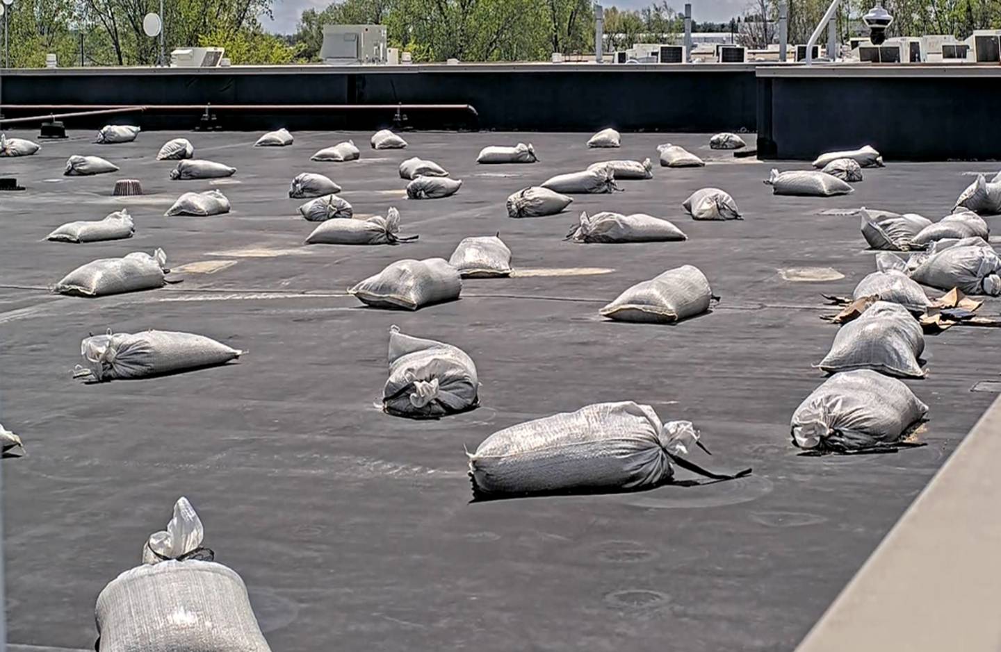 Sandbags cover holes on the roof at Kankakee County Sheriff's Office following damage caused during the March 10 tornado that passed just north of the complex.