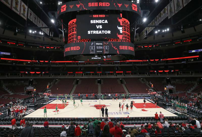 Seneca and Streator boys basketball teams warm up before playing each other during a game on Tuesday, Dec. 21, 2023 at the United Center in Chicago.