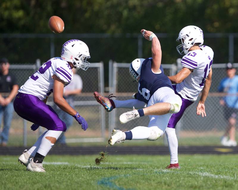 Cary Grove's Charles Ciske dives to block the kick by Hampshire's Joshua Maya on Saturday Oct. 5,2024 in Cary.