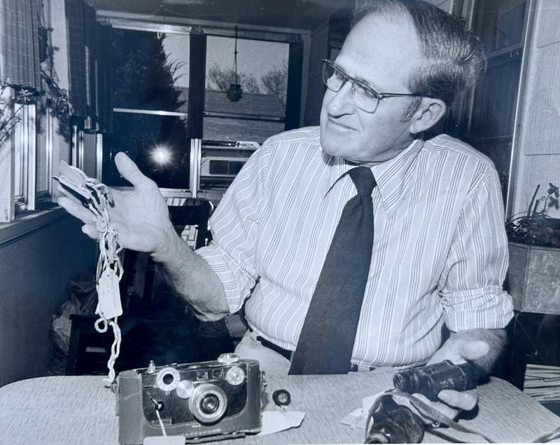 Former La Salle County Sheriff Wayne Hess, looks over evidence from the Starved Rock Murders taken by Steve Stout with the La Salle NewsTribune in the 1980's. Hess was the LaSalle County Sheriff from 1968 to 1970. Weger died on June 22, 2025.