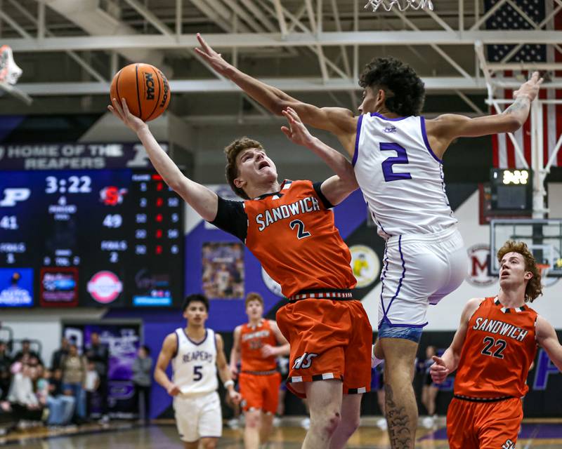 Sandwich's Griffin Somlock (2) puts up a shot defended by Plano's Gabe Steele (2) during their basketball game between Sandwich at Plano. Jan 27, 2025 in Plano.