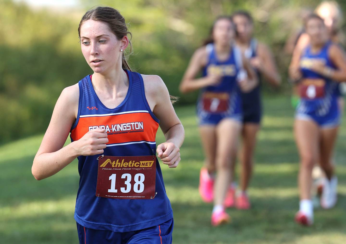 Genoa-Kingston’s Gracie Zapatka leads a pack of runners during the Sycamore Cross Country Invitational Tuesday, Aug. 29, 2023, at Kishwaukee College in Malta.