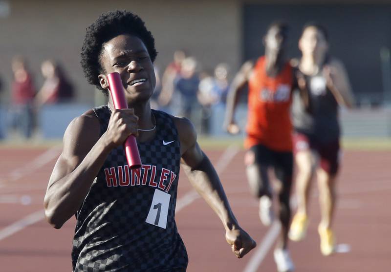 Huntley's Mark Omoniyi cruises to victory as he runs the last leg of the 4x800 meter relay during the Fox Valley Conference  Boys Track and Field Meet on Thursday, May 14, 2026, at Huntley High School.