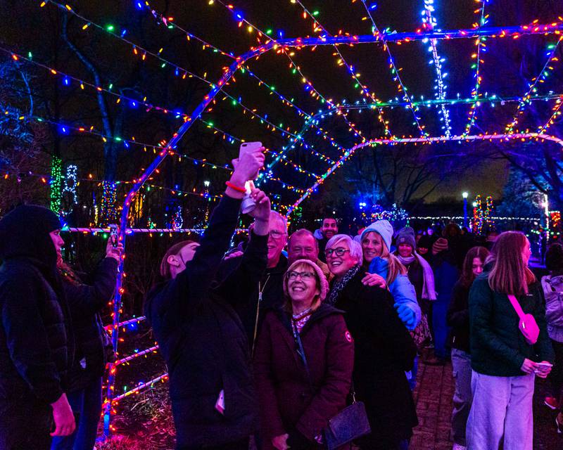 John and Gayle Portenkirchner (front) pose for a group picture with friends at the Lombard Jingle Bell Jubilee. Dec 2, 2023