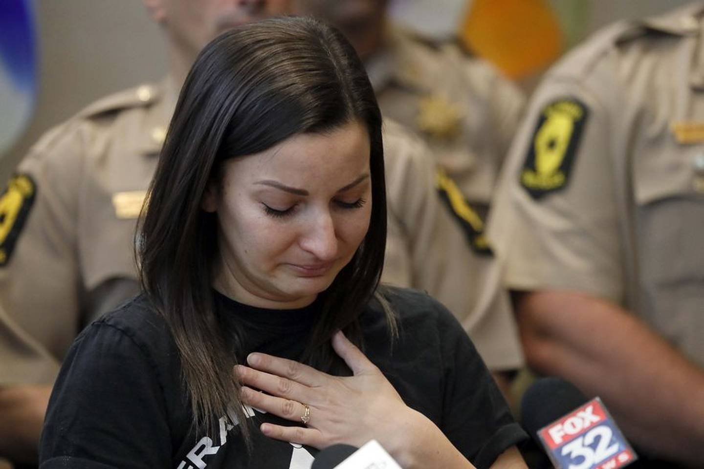 Lauren Frank, wife of state Trooper Brian Frank and a Move Over Law advocate, pauses Saturday as she thanks friends, family and staff members at MarionJoy Rehabilitation Hospital in Wheaton, where her husband has been recovering since a car rear-ended his patrol vehicle stopped at a crash along I-55 in 2021.