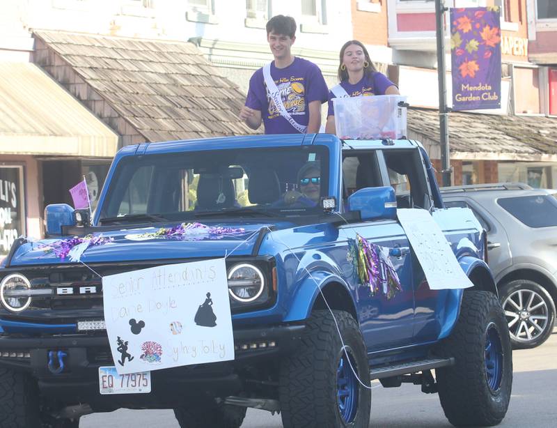 Mendota High School senior attendants Dane Doyle and Sydney Tolley ride down Indiana Avenue during the homecoming parade on Friday, Oct. 3, 2025