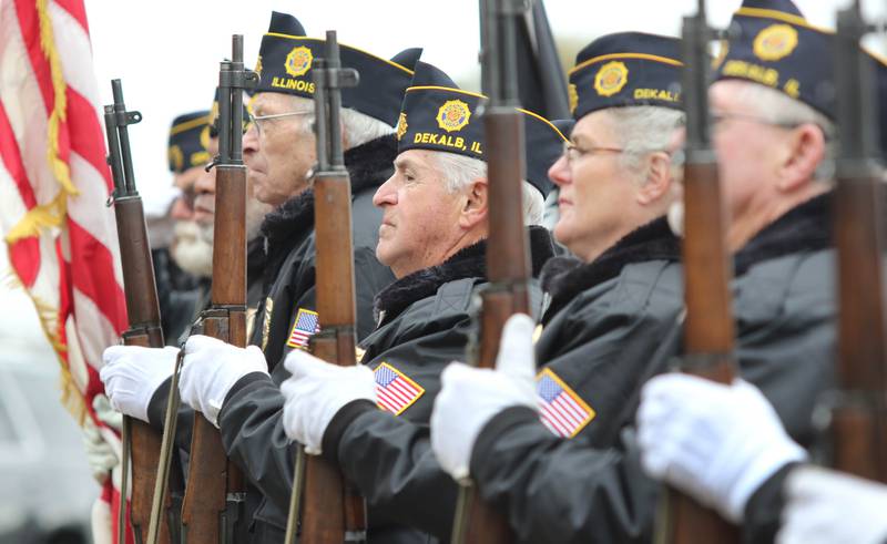 Members of the DeKalb American Legion Post 66 Honor Guard stand at attention Thursday, Nov. 11, 2021, during a Veterans Day and Soldiers' and Sailors' Memorial Clock rededication ceremony at Memorial Park in downtown DeKalb.