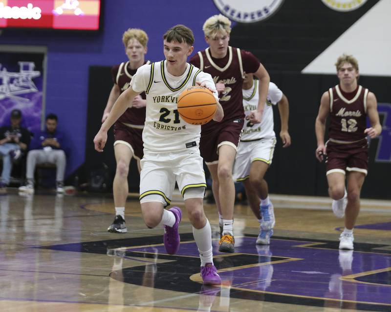 Yorkville Christian's Jordan Purvis (21) races down the court during their Plano Christmas Classic basketball game between Morris at Yorkville Christian Friday, Dec 26, 2025 in Plano.