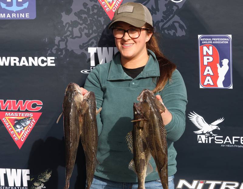 Jena Herrick of Spring Valley, holds her Walleye up for a photo during the annual Masters Walleye Circuit tournament on Friday, March 20, 2026 at the Spring Valley Boat Club.