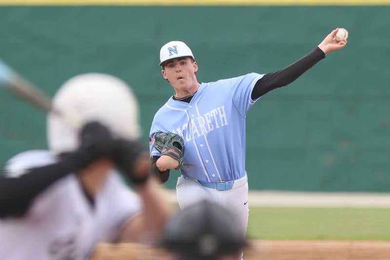Nazareth’s Eddie Donnelly delivers a pitch against Joliet Catholic on Wednesday, April 29, 2026 in Joliet.