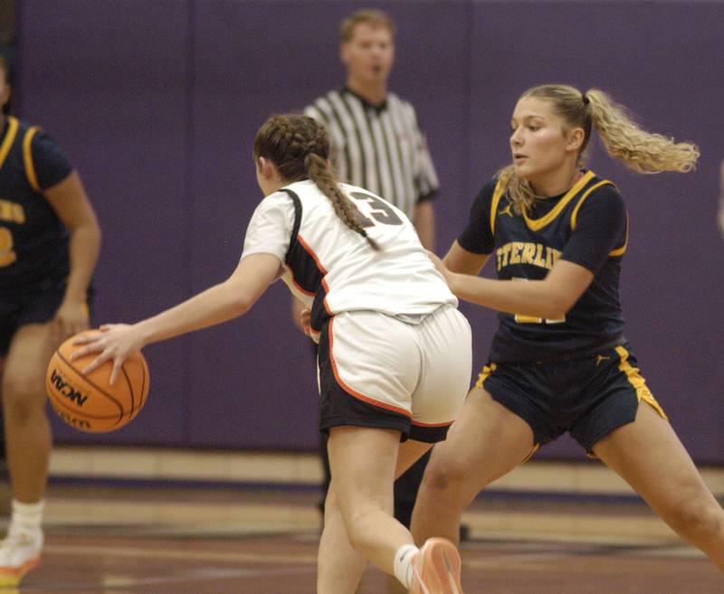 Byron's Brynn Green and Sterling's Jaelynn James play offense and defense. The Sterling Golden Warriors played  the Byron Tigers in the championship game of the Dixon Holiday Tournament at Dixon High School on Monday, December 29th, 2025.