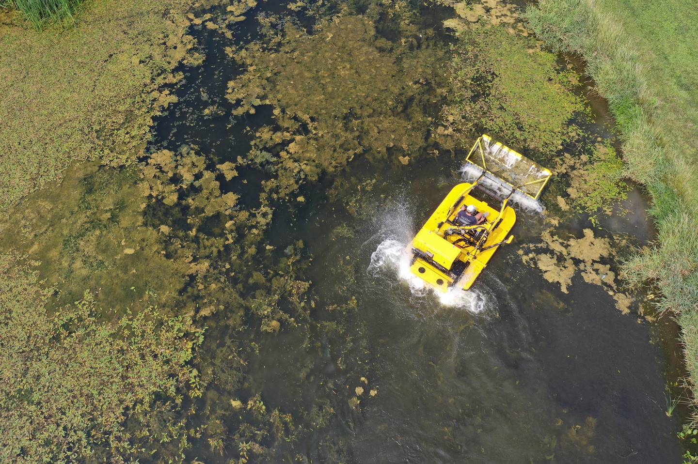 A Weedoo aquatic weed harvester machine removes algae from the Illinois & Michigan Canal on Friday, Aug. 1, 2025 in Ottawa.