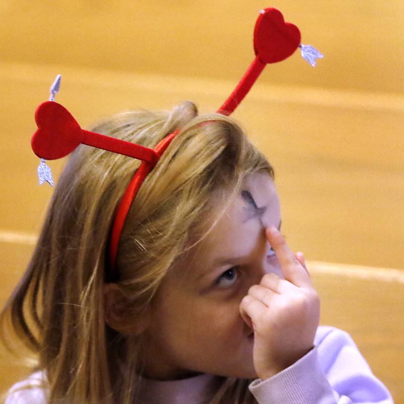 Zeppelin McDermott, 5, checks out the ashes on her forehead on on Wednesday, Feb, 14, 2024, during a service at Zion Evangelical Lutheran Church in McHenry, on Ash Wednesday.