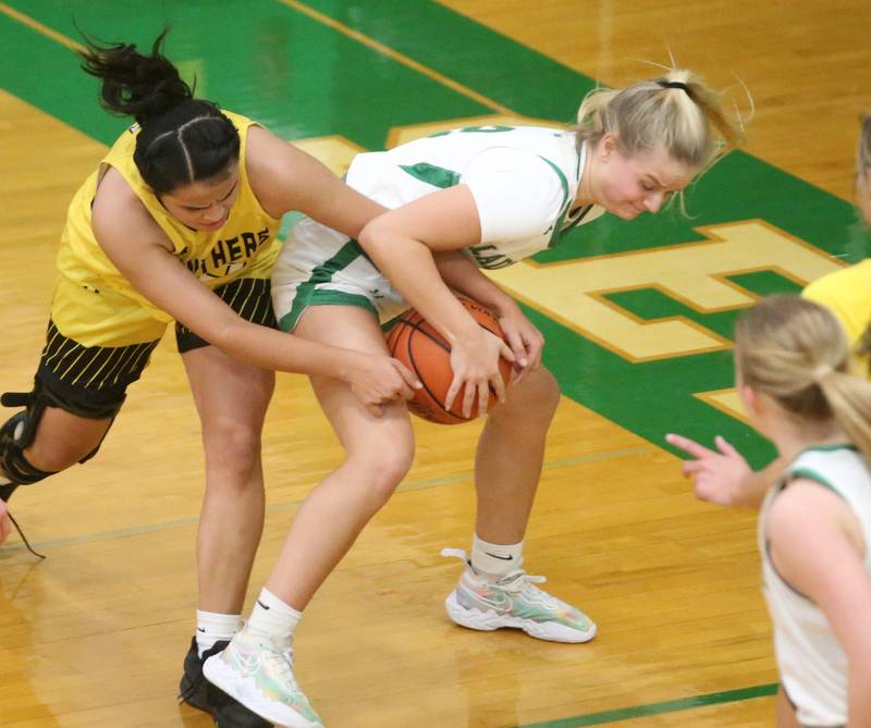 Seneca's Lainie Olson and Putnam County's Esmeralda Avila force a jump ball on Thursday, Jan. 4, 2024 at Seneca High School.