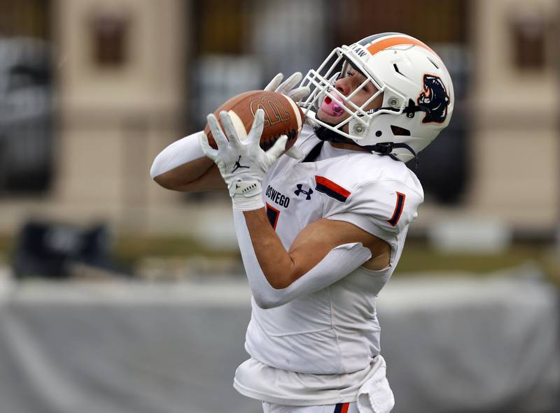 Oswego's Teddy Manikas (1) makes a reception during the varsity football second-round 8A playoff game between Oswego and Lane Tech on Saturday, Nov. 8, 2025 in Chicago.