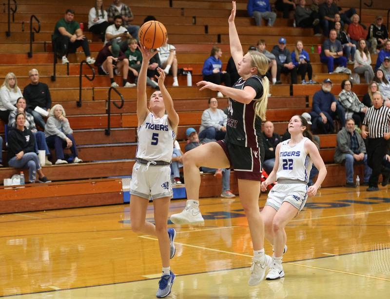 Princeton's Kiyrra Morris runs in for a layup as Illinois Valley Central's Anabelle Myers sprints into the lane to defend during the Princeton High School Girls Basketball Holiday Tournament on Saturday, Nov. 22, 2025 at Princeton HIgh School.