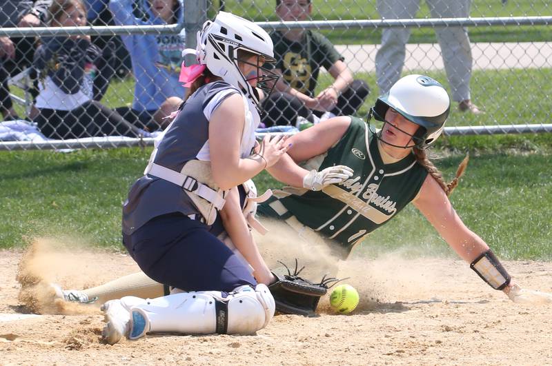 St. Bede's Madelyn Torrence reaches home as Annawan/Wethersfield's Karsyn Rico misses the tag in the Class 1A Regional final game on Saturday, May 20, 2023 in Annawan.