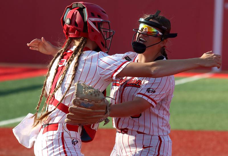 Barrington’s Reese Cullen, left, embraces Katie Taraschewsky after a Fillies victory over Huntley  in IHSA Class 4A Sectional Title Game softball action at the Fields of Dreams on the campus of Barrington High School in Barrington on Friday, June 6, 2025.
