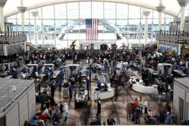 Passengers flee smoking jet on emergency slide after apparent landing gear problem at Denver airport