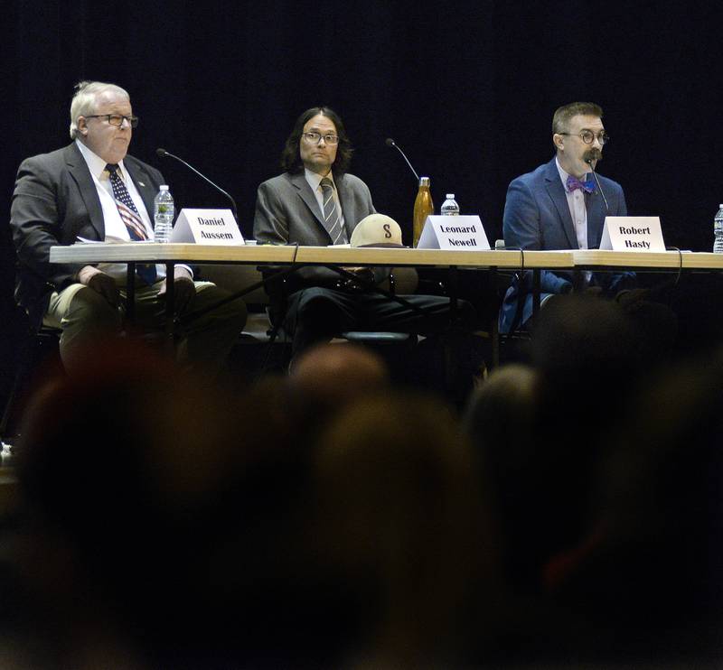Ottawa mayoral candidates (left to right) Daniel Aussem, Leonard Newell and Robert Hasty answer questions Monday, March 13, 2023, during a candidates forum at Central Intermediate School.