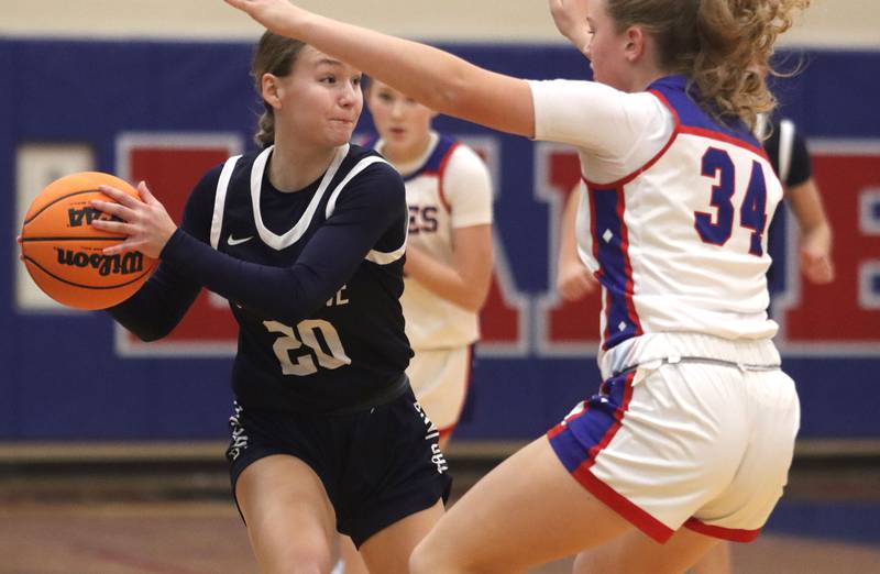 Cary-Grove’s Ava Santucci, left, looks for an option past Lakes’ Makenzie Knapcik in varsity girls basketball action on Friday, Jan. 2, 2026  at Lakes High School in Lake Villa.