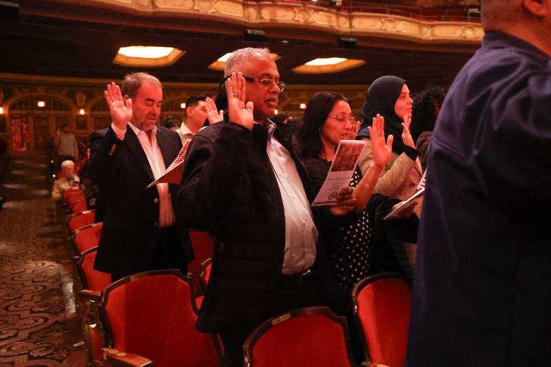 101 applicants for U.S. citizenship from 27 countries take the Oath of Allegiance during the Special Naturalization Ceremony held at the Rialto Square Theatre in downtown Joliet on Tuesday, April 23, 2024.