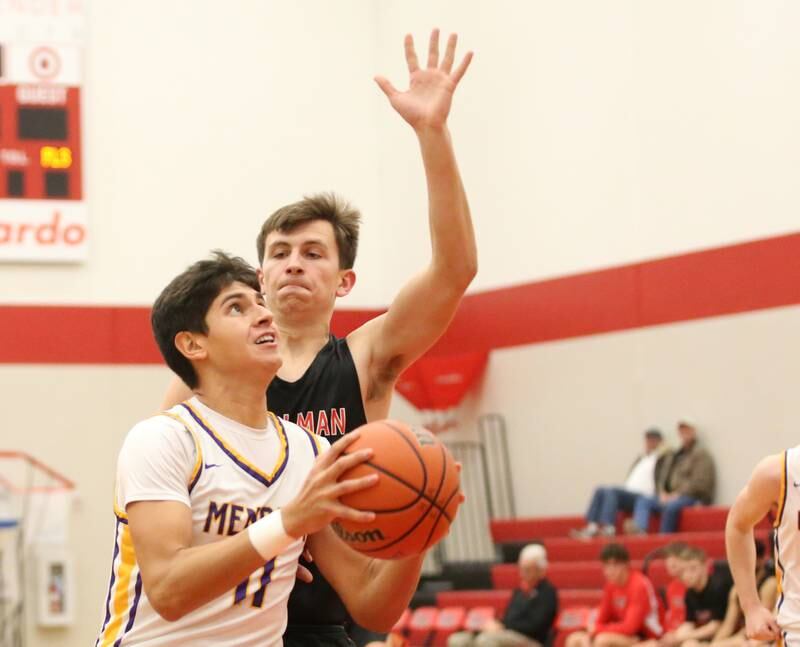 Mendota's Izaiah Nenez runs in front of Stillman Valley's Michael Olando to score a basket during the 49th annual Colmone Classic Tournament on Wednesday, Dec. 6, 2023 at Hall High School.