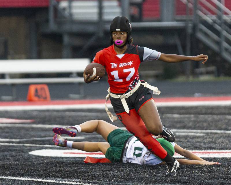 Bolingbrook's Janiya Frazier (17) runs away from pressure during flag football game between Plainfield Central at Bolingbrook Wednesday, Sept 3, 2025  in Bolingbrook.