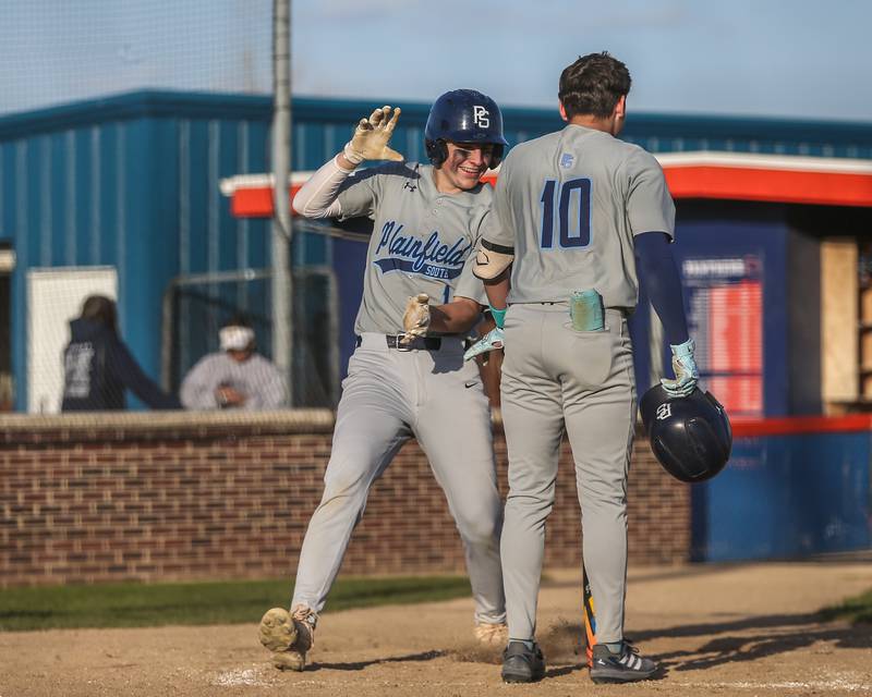 Plainfield South's Cameron Kelliher (1) scores a run during baseball game between Plainfield South at Oswego on Monday, April 14, 2025 in Oswego.