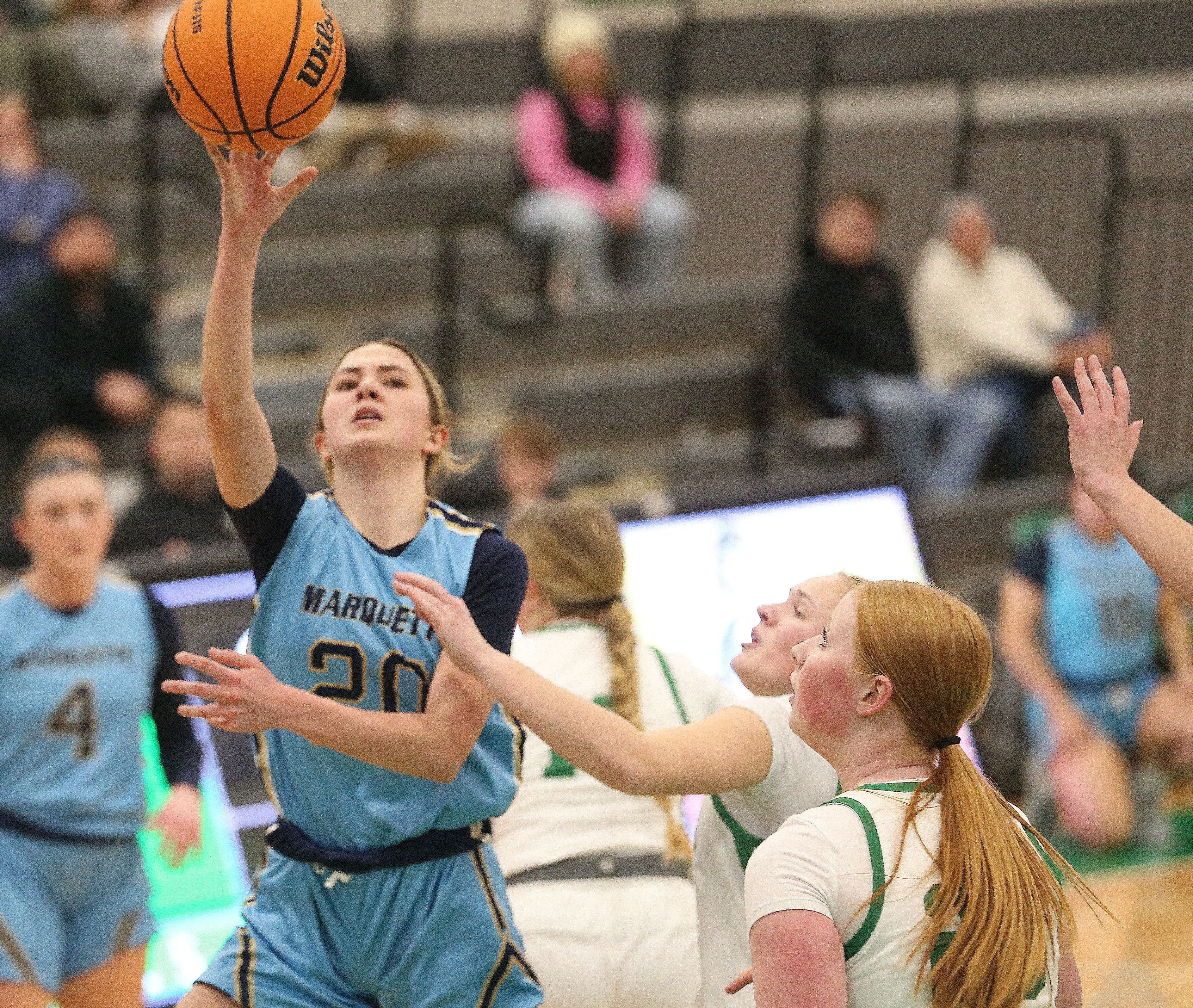 Marquette's Kaitlyn Davis lets go of a shot over Seneca earlier this month.