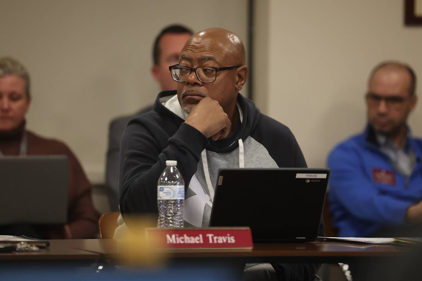 Board member Michael Travis listens to comments from a fellow board member at the Lockport Board of Education meeting on Monday, Nov. 20, 2023, in Lockport.