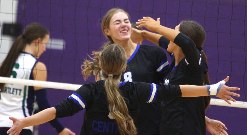 Burlington Central’s Ainsley Wilson and the Rockets celebrate a point against Bartlett in varsity volleyball tournament action on Saturday, Sept. 21, 2024, at Hampshire High School in Hampshire.