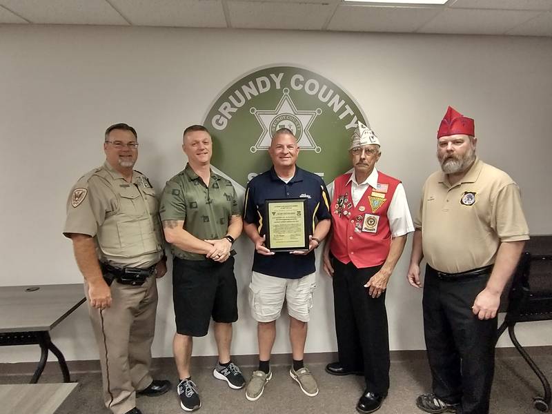 Pictured from left to right is Bailiff Steve Heuttemann of the Blue Chevaliers, Chief Deputy Paul Clampitt, Sheriff Ken Briley, Blue Chevaliers Director Jerry Terando and Chef de Gare Rob Dettmann.