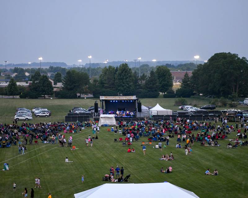 Community members enjoy the music of Marlon and the Shakes during PrairieFest on Thursday June 12, 2025, held at PrairieFest Park in Oswego.